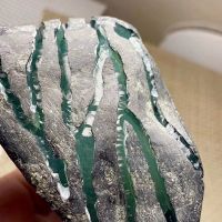 莫莫亮冰种水泥皮翡翠原石开窗料
